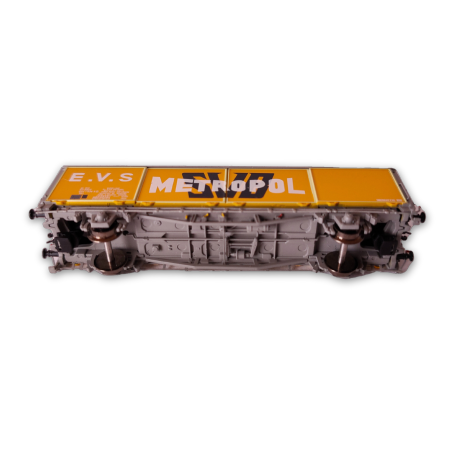 vue des bogies wagon SNCF jaune logo métropol blanc de la marque trains160